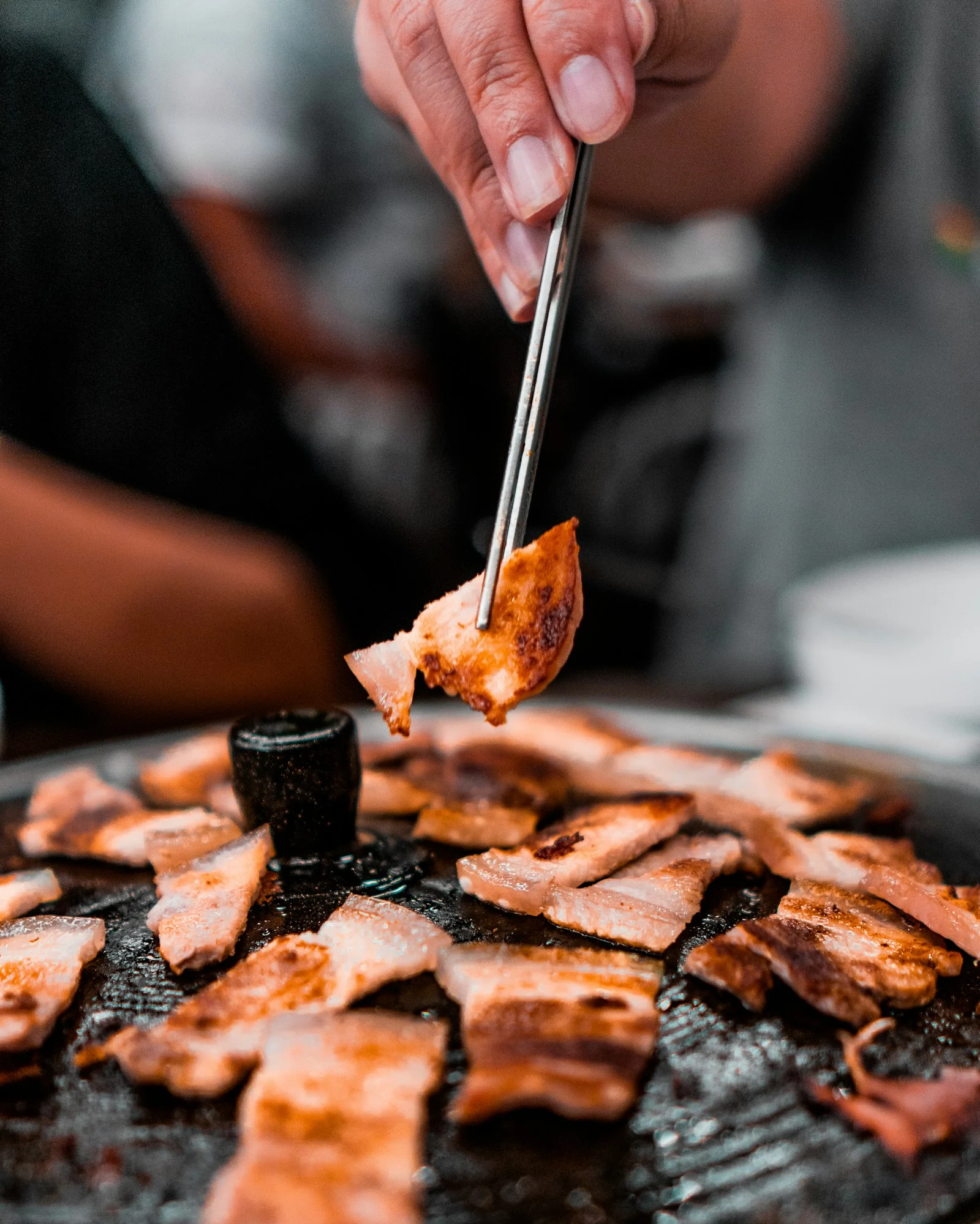 Samgyeopsal pork belly on a Korean BBQ grill