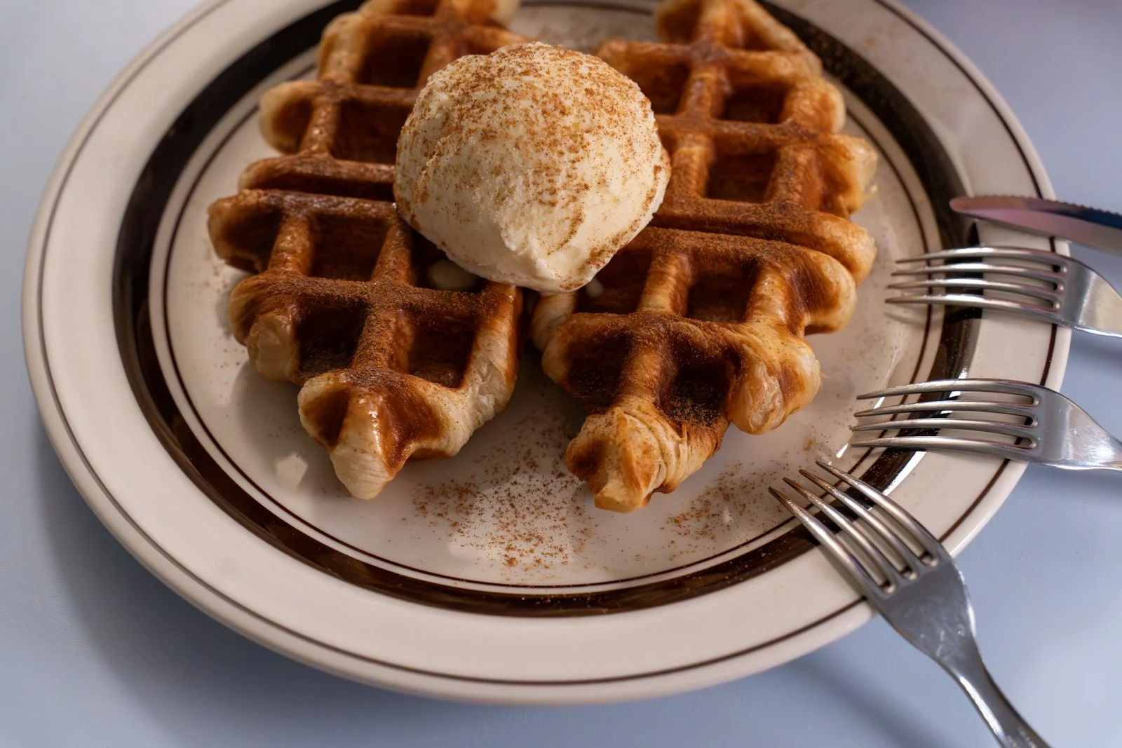 Croffle topped with a scoop of ice cream
