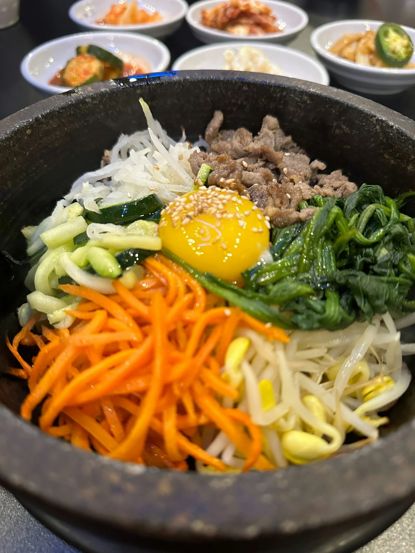 Bibimbap served with Korean side dishes