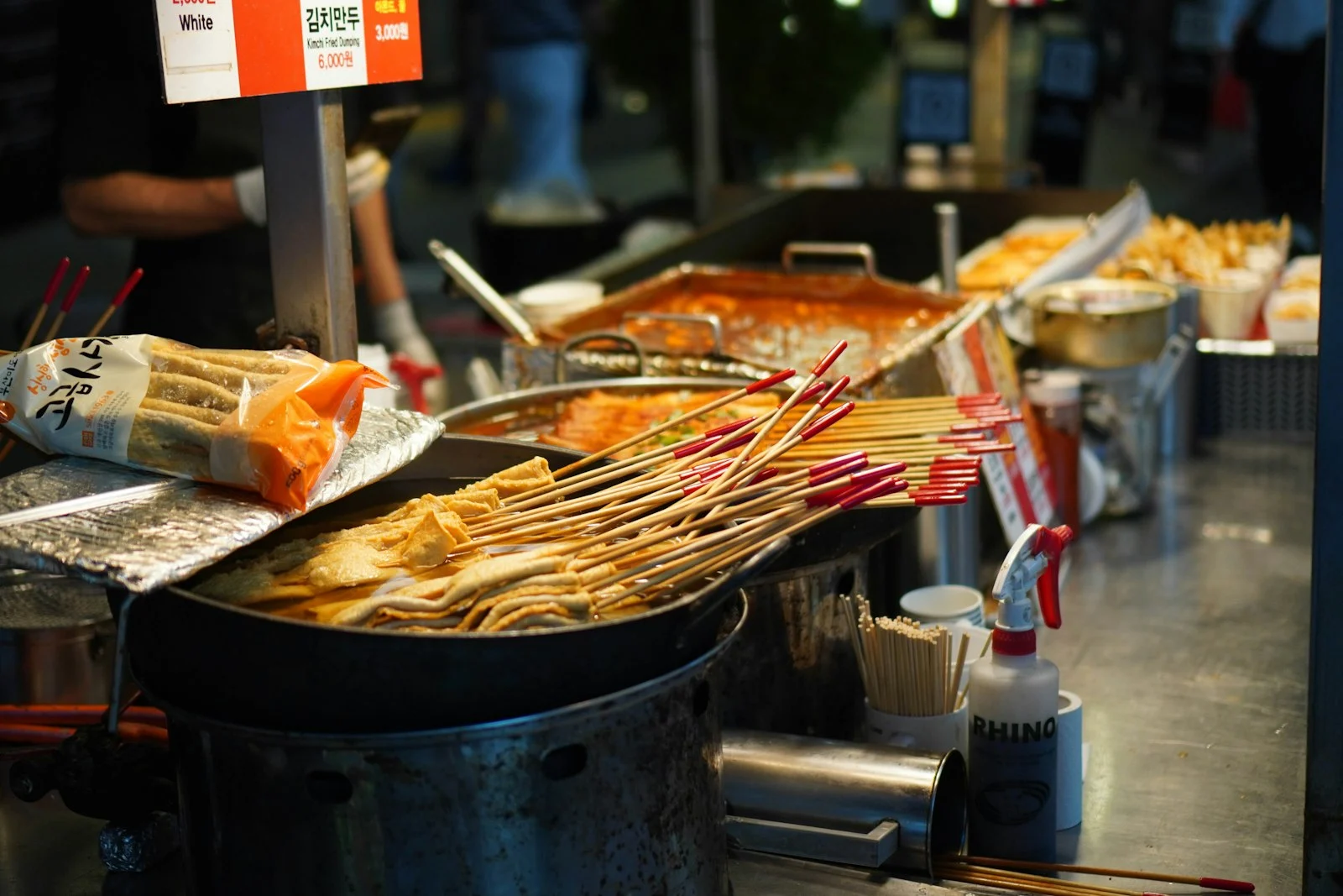 Fish cake skewers simmering at a Myeongdong night market stall, Seoul