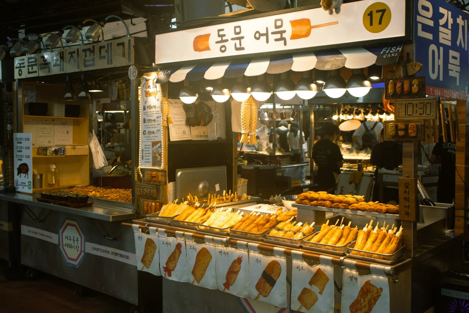Korean street food stall with fried snacks and fish cake, Jeju